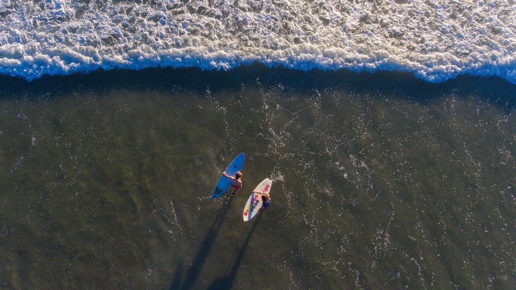 surfers-are-waiting-wave-with-surfboard